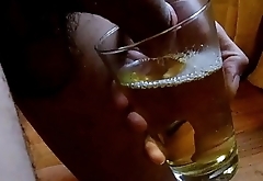A mix of pee and cum in a glass
